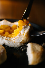 Homemade dumplings with sour cream and fried onions on plate