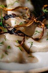 Cottage cheese pancakes with cream and peach jam on plate