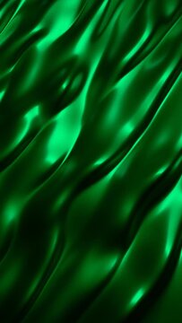 Abstract background luxury green cloth. Liquid like waves on green material. Ripples on green surface with highlights flow. Vertical animation loop