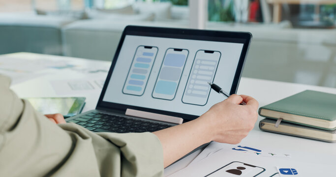 Hands, laptop screen and phone design with person at desk in office for ui or ux innovation. Computer, creative and planning with mobile app designer at work for development of communication tech