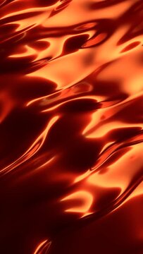 Abstrace waves on orange metal-like surface with beautiful reflections. Flow abstract waves on orange surface in loop. Vertical animation