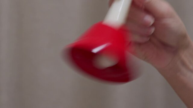 Clear Note: Hand Rings Red Handbell with High-Pitched Chiming Sound.