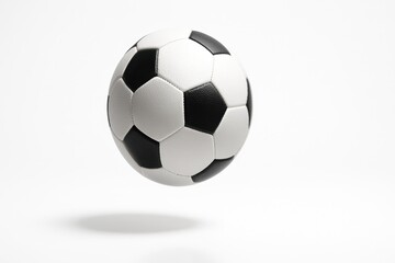 Naklejka premium Soccer ball suspended mid air gentle clockwise spin with a subtle motion trace at the panel edges center razor sharp on white