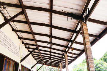 Structure is gray aluminum roof house, home sheet with steel beam. Strong enough to withstand sunlight, rain and storms, does not rust. Corrugated metal cladding on industrial building.