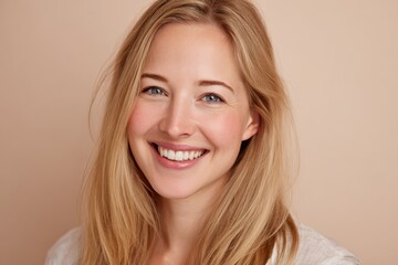 Fototapeta premium Radiant head-and-shoulders portrait of a blonde woman in a soft pastel setting