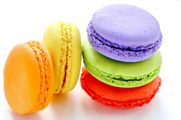 pile of colorful and tasty french macaroons on white background