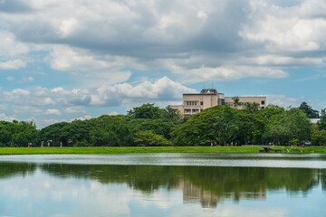 Fototapeta premium a public place leisure travel landscape lake views at Ang Kaew Chiang Mai University and Doi Suthep nature forest Mountain views spring cloudy sky background with white cloud.