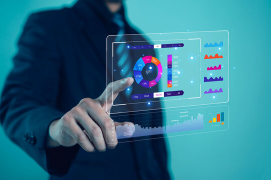 Businessman touching virtual data analytics dashboard with digital charts and AI interface. Concept of big data, futuristic technology, innovation, and business intelligence visualization.