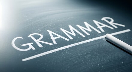 Chalkboard with the word grammar written in white chalk closeup