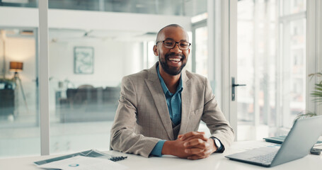 Fototapeta premium Happy, laptop and portrait of black man in office with confidence for finance career growth. Smile, computer and African male financial manager with pride for job development in workplace in Nigeria.