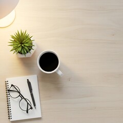 A minimalist workspace setup featuring a cup of coffee, a small potted plant, a pair of glasses, a pen, and a notebook on a light wooden surface illuminated by soft lighting