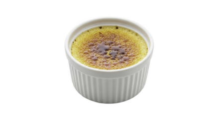 Cr?me br?l?e dessert in a white ramekin with caramelised sugar on cream