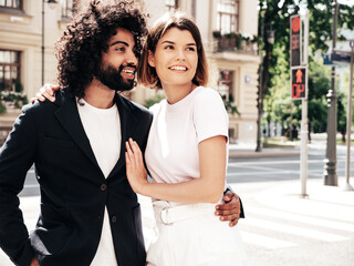 Smiling beautiful woman and her handsome boyfriend. Sexy cheerful multiracial family having tender...