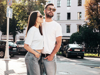 Smiling beautiful woman and her handsome boyfriend. Woman in casual summer jeans clothes. Happy...