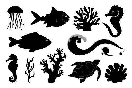 Collection of black silhouette marine life and ocean elements on white background