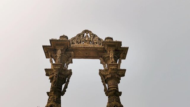 Kirti Toran Vadnagar Gujarat India showing ancient carved stone arch monument with detailed sculptures and heritage art under bright sky, symbol of rich Indian culture and history.