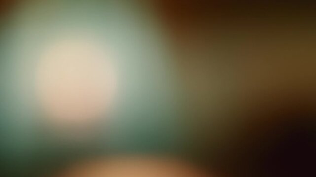 An abstract background with de-focused light halos in warm colors