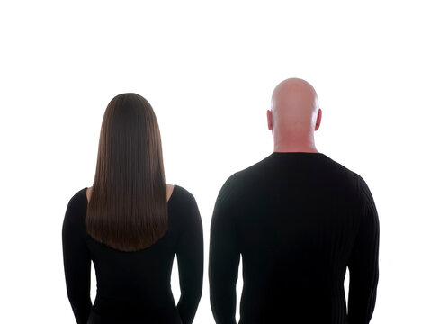 Back view of woman with long straight brown hair and bald man, both wearing black shirts, standing side by side against transparent background, neutral mood