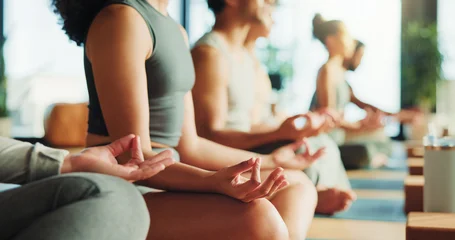 Fotobehang Lotusbloem Zen, people or hands in yoga class with lotus pose for meditation, chakra healing or wellness. Group, relax or yogi in health studio with mindfulness exercise for inner peace, gratitude or awareness.  © peopleimages.com