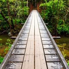 Obraz premium Wooden boardwalk bridge over a river in a forest.