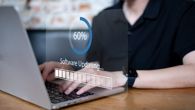 Programmer working on latest release software update download for user digital computer system upgrade data information protection privacy cybersecurity to prevent crime hacker mobile refresh web