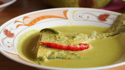 Gulai kuning ikan. Fish in yellow curry.