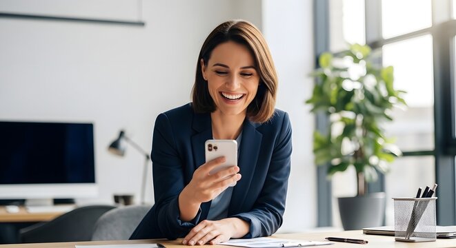 Businesswoman smiling at smartphone in modern office setting for professional use