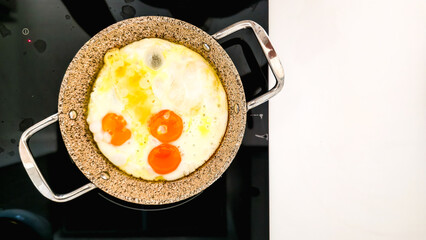 Fried Eggs with Melted Cheese