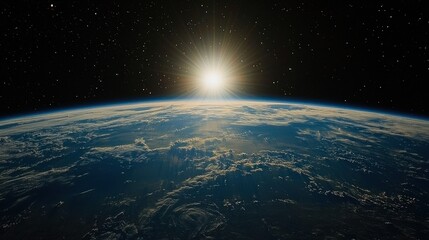 Obraz premium Sunrise view from space over Earth, with clouds and a starry background