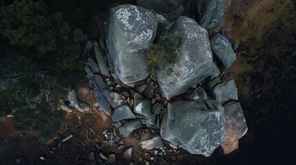 Rock Pile from Above: A striking collection of weathered rocks and boulders, forming a compelling cluster against the backdrop of nature, capturing their raw texture and timeless appeal.