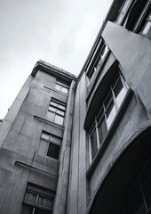 Obraz premium Low-angle view of a weathered, multi-story concrete building