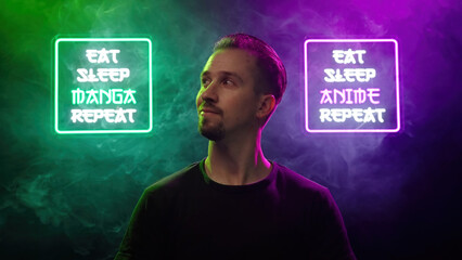 Male person look between two futuristic neon signs Eat Sleep Manga Repeat and Eat Sleep Anime Repeat