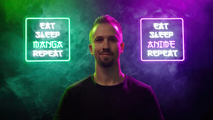 Male person look between two futuristic neon signs Eat Sleep Manga Repeat and Eat Sleep Anime Repeat