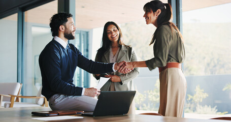 Office, business people and handshake with team for welcome, greeting or introduction. Collaboration, shaking hands and happy workers in meeting for negotiation, b2b deal or thank you for partnership © BuyOutFelix04/peopleimages.com