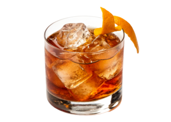Amber cocktail with ice and orange peel in glass