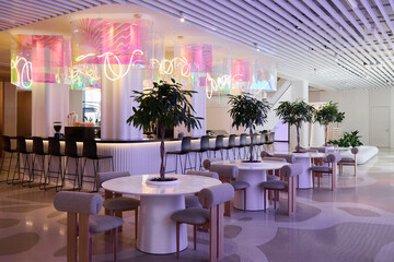 Modern cafe interior with bright decor and seating arrangements