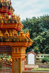 Ornate golden gate detail at Wat Chalong temple, Phuket