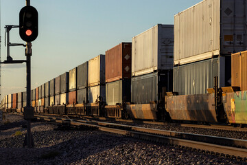 A container stack train trails off into the distance