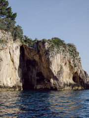 Island with caves on the Amalfi Coast in Italy