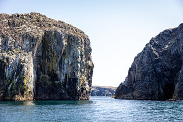 Naklejka premium Towering Cliffs Opening at the Sea