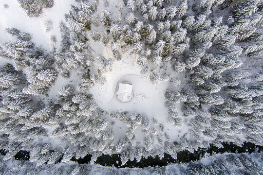 Aerial view of a snow covered winter landscape at dawn - Powered by Adobe
