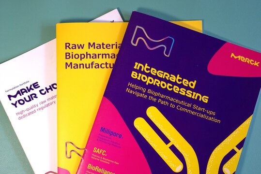 three colorful brochures related to the biopharmaceutical industry