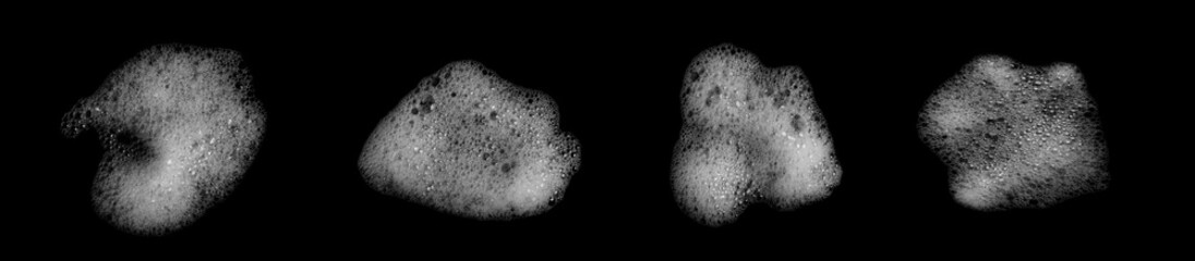 Set of white soap foam bubbles isolated on black background, realistic froth texture for cleaning design, hygiene concepts, and advertising Perfect for bathroom, detergent or freshness product visuals