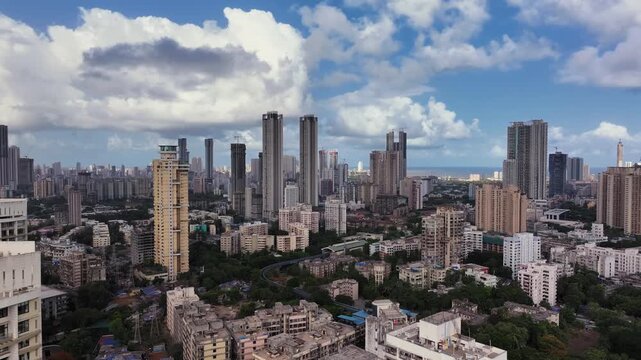 Aerial view of Mumbai city in Maharashtra, India. Beautiful cloudy weather during monsoon. Indian Cityscape