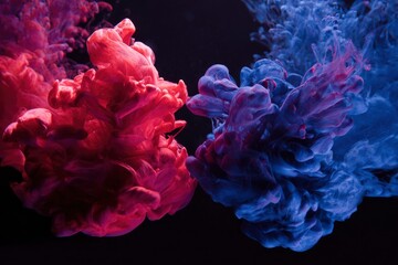 Vibrant red and blue fluid plumes dramatically swirl and gracefully disperse against a deep, dark background, creating a mesmerizing abstract spectacle. The dynamic interplay of contrasting colors and