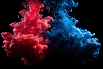A captivating abstract image featuring vibrant red and blue liquid ink diffusing and swirling gracefully underwater against a stark black background. The contrasting colors create a dynamic, ethereal 