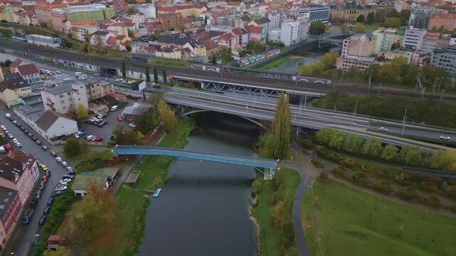 Aerial views modal bridges crossing river amid Pilsen city cityscape