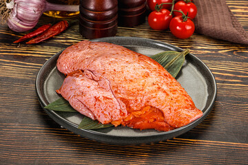 Raw marinated duck breast for cooking