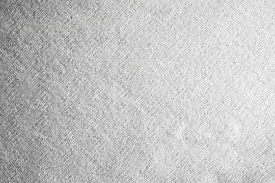 Seamless recycled paper pattern with subtle speckle and fiber effect in white and soft gray. Organic grain texture perfect for eco design, packaging, stationery, or backgrounds. Drag to swatches