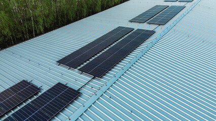 Fototapeta premium Renewable energy system on blue metal roof
